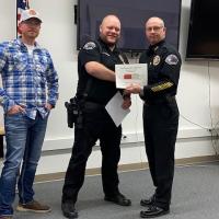 Officer Hansen receiving award