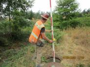 Elevation verification by contractor of the existing control structure (moderates flow) at the upper pond