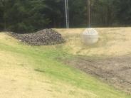 Lower pond with new spillway and control structure and sprouting hydroseeding