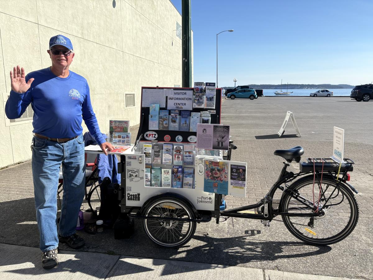 Mobile Greeter with e-bike cart on Water Street